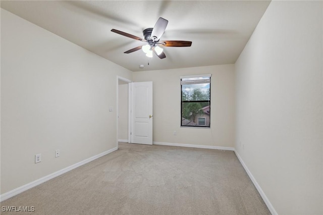 10996 Cherry Laurel Dr, Fort Myers, FL 33912 - empty room featuring light carpet, ceiling fan, and baseboards
