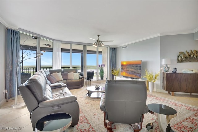 1050 Borghese Ln Unit 801, Naples, FL 34114 - living area featuring ornamental molding, light tile patterned flooring, ceiling fan, healthy amount of natural light, and baseboards