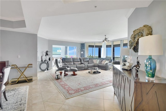 1050 Borghese Ln Unit 801, Naples, FL 34114 - living area featuring ornamental molding, ceiling fan, plenty of natural light, and light tile patterned flooring