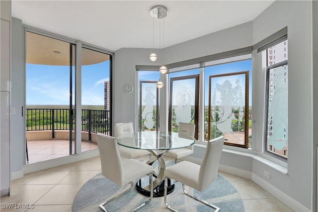 1050 Borghese Ln Unit 801, Naples, FL 34114 - dining room featuring light tile patterned floors and baseboards