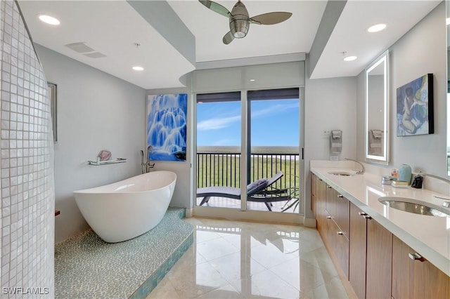 1050 Borghese Ln Unit 801, Naples, FL 34114 - full bathroom with a soaking tub, double vanity, ceiling fan, tile patterned flooring, and recessed lighting
