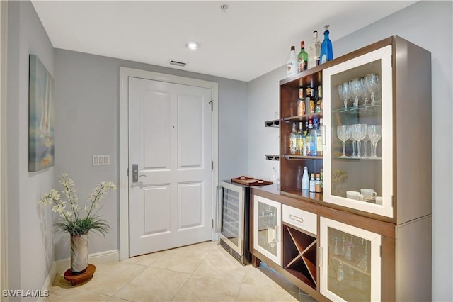 1050 Borghese Ln Unit 801, Naples, FL 34114 - indoor dry bar featuring wine cooler, tile patterned floors, and baseboards