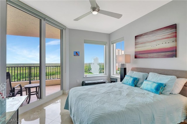 1050 Borghese Ln Unit 801, Naples, FL 34114 - bedroom featuring access to outside, tile patterned flooring, and a ceiling fan