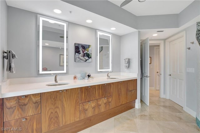 1050 Borghese Ln Unit 801, Naples, FL 34114 - full bathroom with double vanity, recessed lighting, marble finish floors, and baseboards