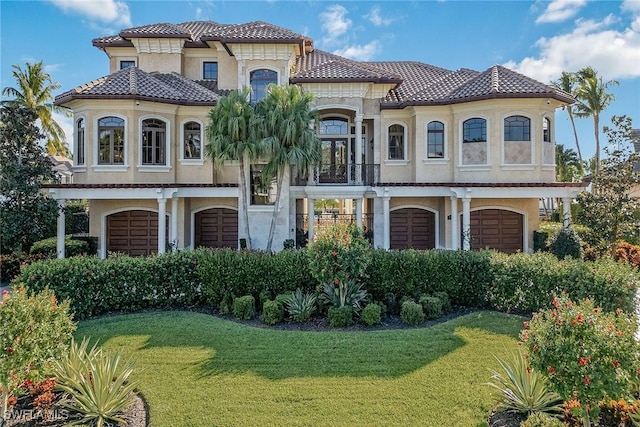 1547 Caxambas Ct, Marco Island, FL 34145 - mediterranean / spanish-style home featuring a tiled roof, a front lawn, and stucco siding