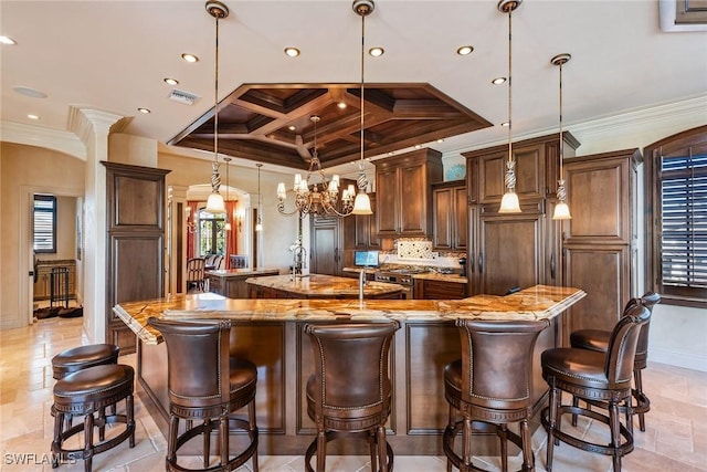 1547 Caxambas Ct, Marco Island, FL 34145 - kitchen featuring a large island with sink, coffered ceiling, crown molding, a chandelier, and recessed lighting