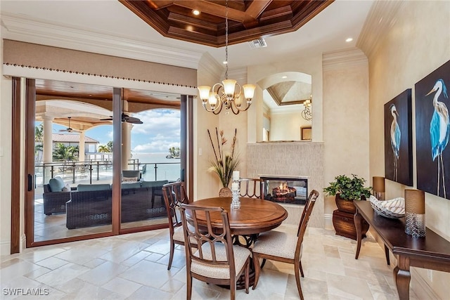 1547 Caxambas Ct, Marco Island, FL 34145 - dining area with coffered ceiling, crown molding, stone tile floors, a chandelier, and beam ceiling