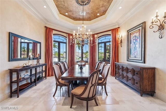 1547 Caxambas Ct, Marco Island, FL 34145 - dining room with a chandelier, plenty of natural light, a tray ceiling, stone tile floors, and ornamental molding