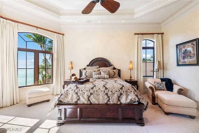 1547 Caxambas Ct, Marco Island, FL 34145 - bedroom featuring light colored carpet, crown molding, a tray ceiling, and a ceiling fan