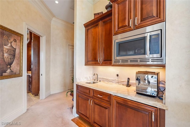 1547 Caxambas Ct, Marco Island, FL 34145 - bar with stainless steel microwave, a sink, light carpet, baseboards, and crown molding