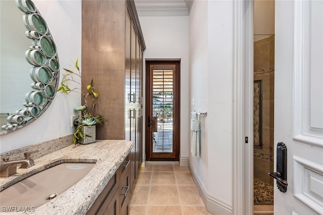 1547 Caxambas Ct, Marco Island, FL 34145 - bathroom with vanity, crown molding, tile patterned floors, and a tile shower