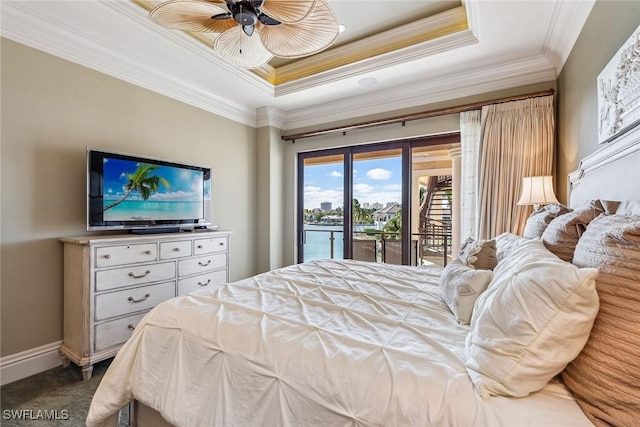 1547 Caxambas Ct, Marco Island, FL 34145 - bedroom featuring access to exterior, ornamental molding, a raised ceiling, baseboards, and carpet floors