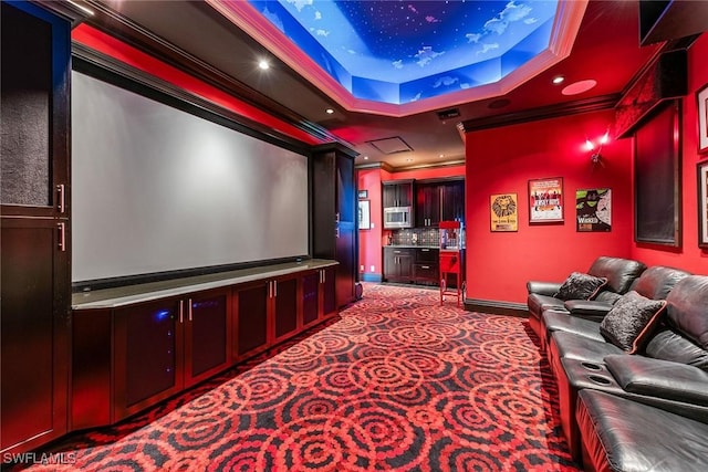 1547 Caxambas Ct, Marco Island, FL 34145 - home theater room with ornamental molding, a tray ceiling, carpet, baseboards, and recessed lighting