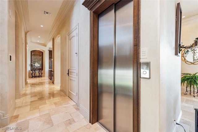 1547 Caxambas Ct, Marco Island, FL 34145 - hallway with crown molding, arched walkways, stone tile floors, elevator, and baseboards