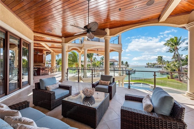 1547 Caxambas Ct, Marco Island, FL 34145 - view of patio / terrace featuring an outdoor hangout area, a ceiling fan, and a water view