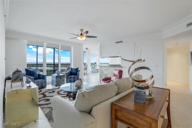 1060 Borghese Ln Unit 1005, Naples, FL 34114 - living area featuring light tile patterned floors and ceiling fan