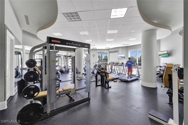 1060 Borghese Ln Unit 1005, Naples, FL 34114 - gym with a paneled ceiling
