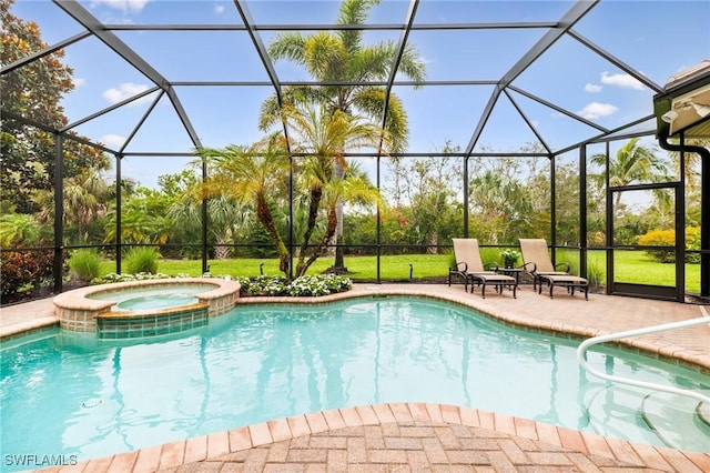 20081 Chapel Trce, Estero, FL 33928 - view of swimming pool featuring glass enclosure, a patio, a pool with connected hot tub, and a lawn