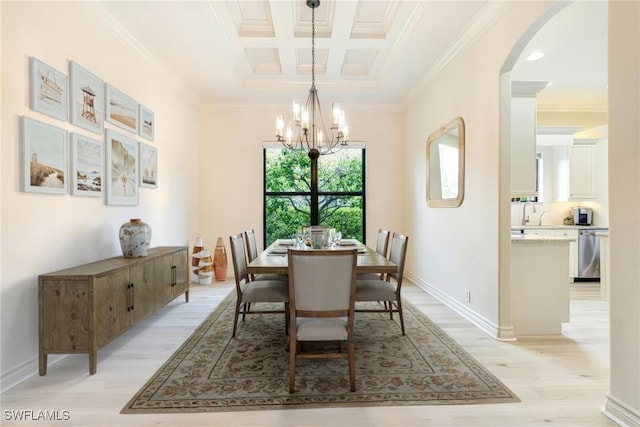 20081 Chapel Trce, Estero, FL 33928 - dining space with ornamental molding, arched walkways, light wood finished floors, a chandelier, and coffered ceiling