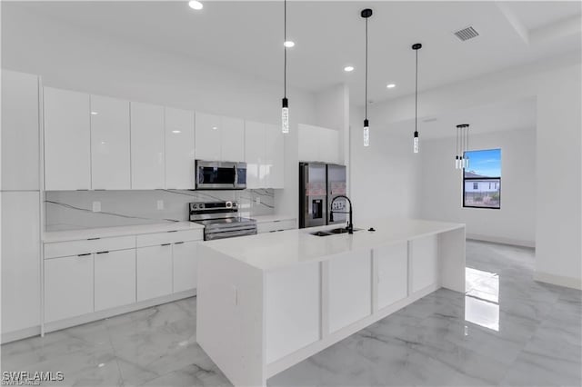 1059 Brenton Ave, Lehigh Acres, FL 33974 - kitchen featuring appliances with stainless steel finishes, light marble finish floors, modern cabinets, white cabinetry, and recessed lighting