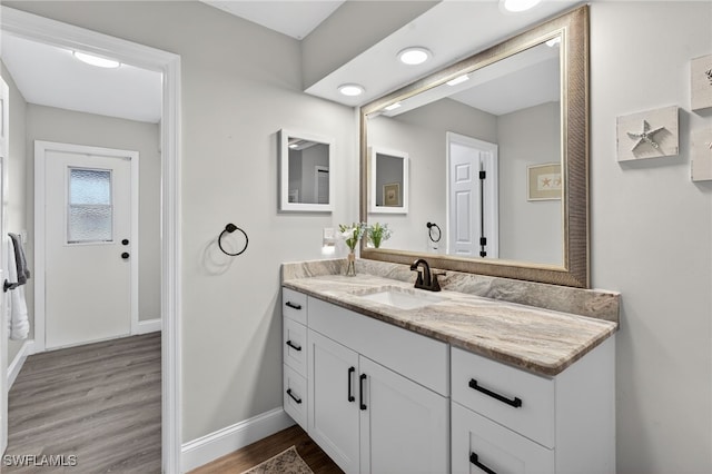 24769 Paradise Rd, Bonita Springs, FL 34135 - bathroom featuring vanity and wood finished floors