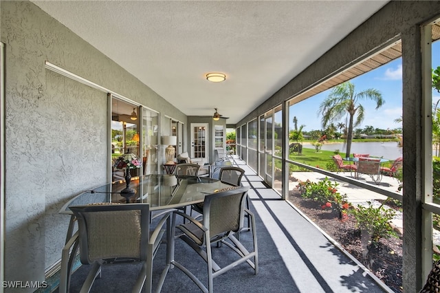 24769 Paradise Rd, Bonita Springs, FL 34135 - sunroom with a water view, outdoor dining space, and a ceiling fan