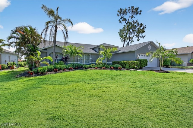 24769 Paradise Rd, Bonita Springs, FL 34135 - ranch-style house with a garage, a front yard, stucco siding, and concrete driveway