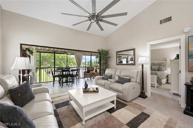 15444 Admiralty Cir Unit 10, North Fort Myers, FL 33917 - living area with high vaulted ceiling, a ceiling fan, and light colored carpet