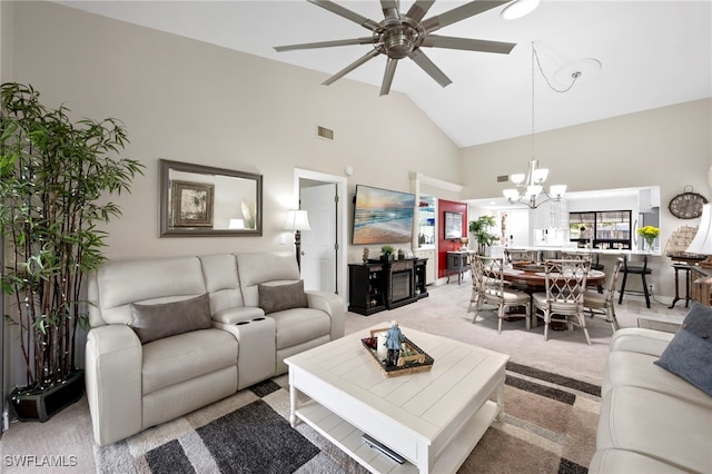 15444 Admiralty Cir Unit 10, North Fort Myers, FL 33917 - living area featuring high vaulted ceiling, ceiling fan, light carpet, and a chandelier