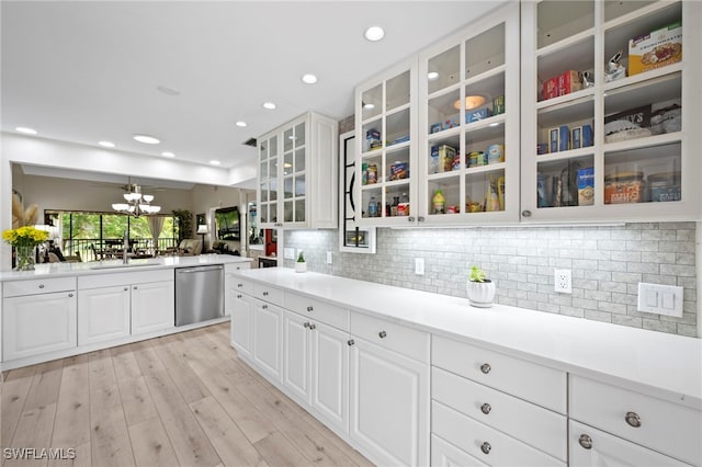 15444 Admiralty Cir Unit 10, North Fort Myers, FL 33917 - kitchen featuring stainless steel dishwasher, glass insert cabinets, white cabinets, a sink, and recessed lighting
