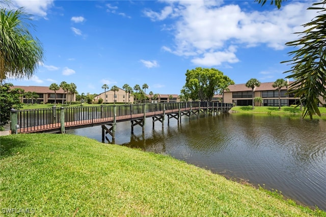 15444 Admiralty Cir Unit 10, North Fort Myers, FL 33917 - dock with a yard, a water view, and a residential view