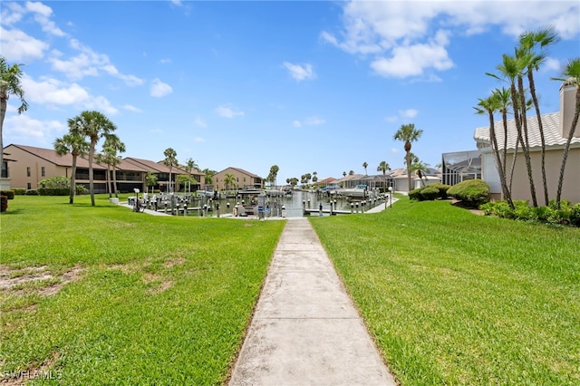 15444 Admiralty Cir Unit 10, North Fort Myers, FL 33917 - view of property's community with a boat dock, boat lift, a residential view, and a lawn