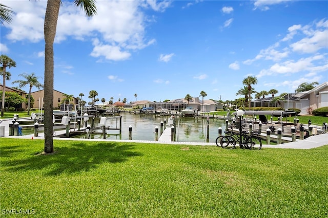 15444 Admiralty Cir Unit 10, North Fort Myers, FL 33917 - dock with boat lift, a residential view, a water view, and a yard