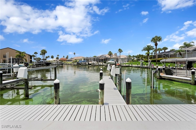 15444 Admiralty Cir Unit 10, North Fort Myers, FL 33917 - dock area featuring a water view, a residential view, and boat lift