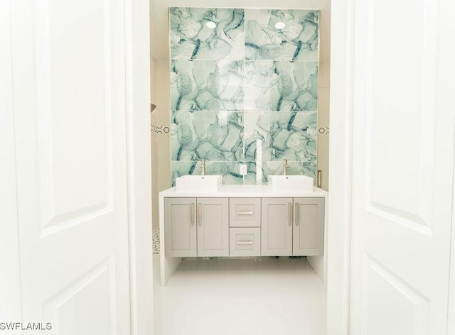717 Calvin Ave, Lehigh Acres, FL 33972 - full bathroom with double vanity and tile patterned flooring