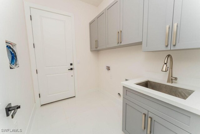 717 Calvin Ave, Lehigh Acres, FL 33972 - washroom with cabinet space, hookup for a washing machine, and baseboards
