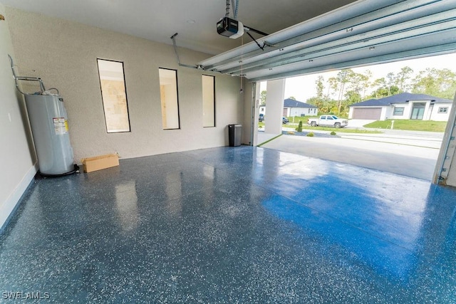 717 Calvin Ave, Lehigh Acres, FL 33972 - garage featuring water heater and a garage door opener
