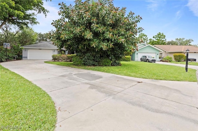 10811 Breaker Ln, Naples, FL 34109 - view of front facade with a front lawn and a detached garage