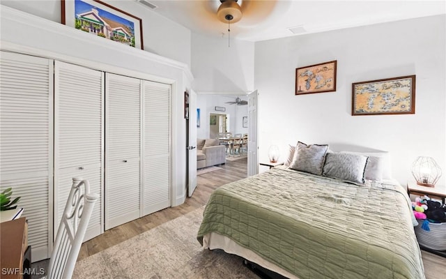 10811 Breaker Ln, Naples, FL 34109 - bedroom featuring light wood-style flooring, a closet, and a ceiling fan