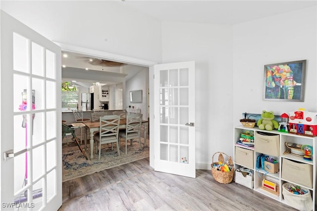 10811 Breaker Ln, Naples, FL 34109 - playroom with french doors, wood finished floors, a ceiling fan, and ornate columns