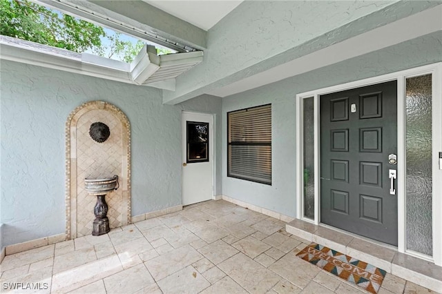 10811 Breaker Ln, Naples, FL 34109 - entrance to property featuring stucco siding and a patio