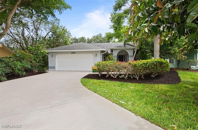 10811 Breaker Ln, Naples, FL 34109 - single story home with stucco siding, an attached garage, concrete driveway, and a front lawn