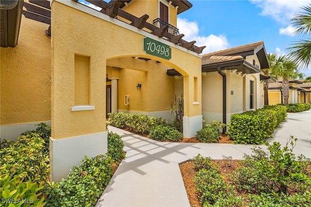 10498 Casella Way Unit 202, Fort Myers, FL 33913 - view of exterior entry with stucco siding