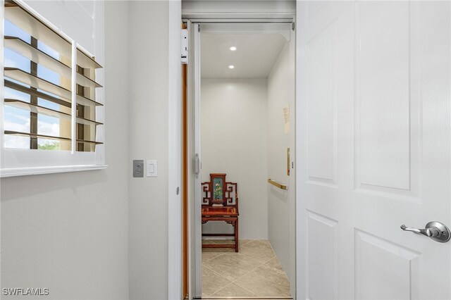 10498 Casella Way Unit 202, Fort Myers, FL 33913 - corridor with recessed lighting and light tile patterned flooring