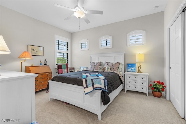 10498 Casella Way Unit 202, Fort Myers, FL 33913 - bedroom with light carpet, ceiling fan, and a closet