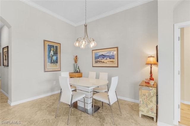 10498 Casella Way Unit 202, Fort Myers, FL 33913 - dining room featuring arched walkways, crown molding, baseboards, a chandelier, and tile patterned flooring