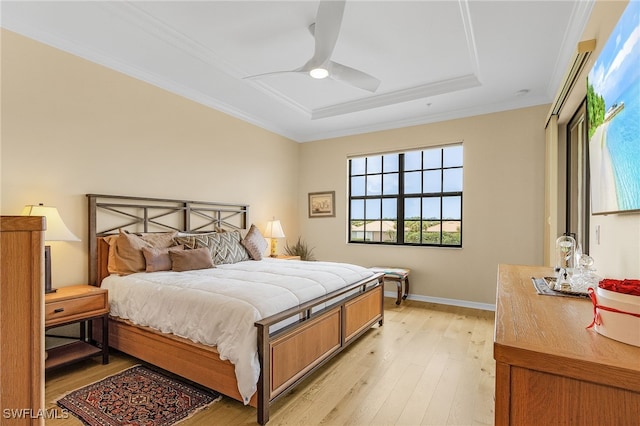 10498 Casella Way Unit 202, Fort Myers, FL 33913 - bedroom with a raised ceiling, light wood-type flooring, crown molding, a ceiling fan, and baseboards