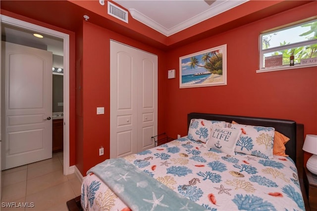 4450 Chickee Hut Ct Unit 101, Bonita Springs, FL 34134 - bedroom with a closet, light tile patterned flooring, crown molding, and baseboards