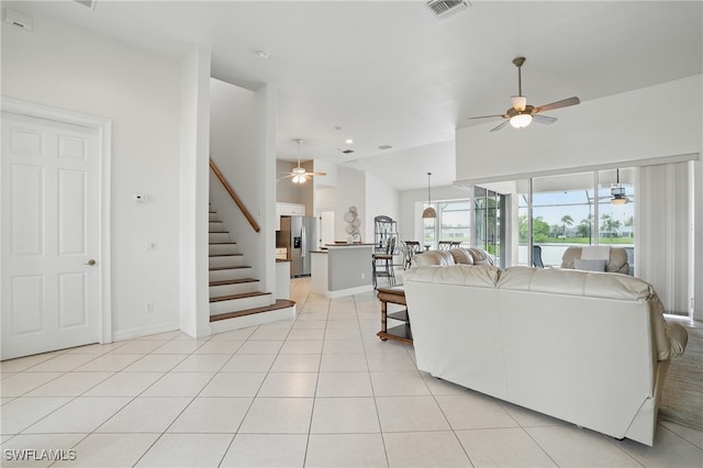 5408 SW 26th Ct, Cape Coral, FL 33914 - living room featuring a ceiling fan, stairs, and light tile patterned floors