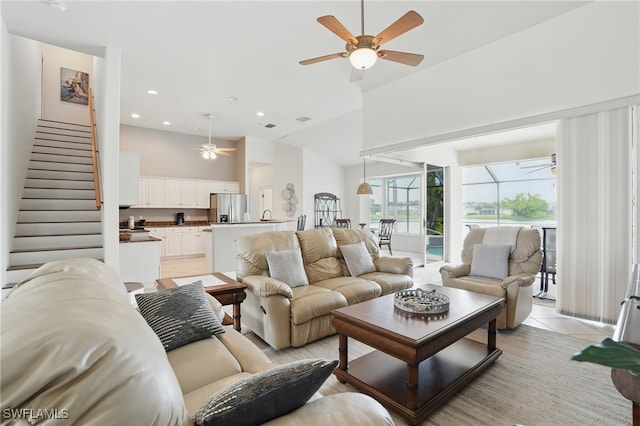 5408 SW 26th Ct, Cape Coral, FL 33914 - living area with ceiling fan, stairway, light tile patterned flooring, recessed lighting, and high vaulted ceiling